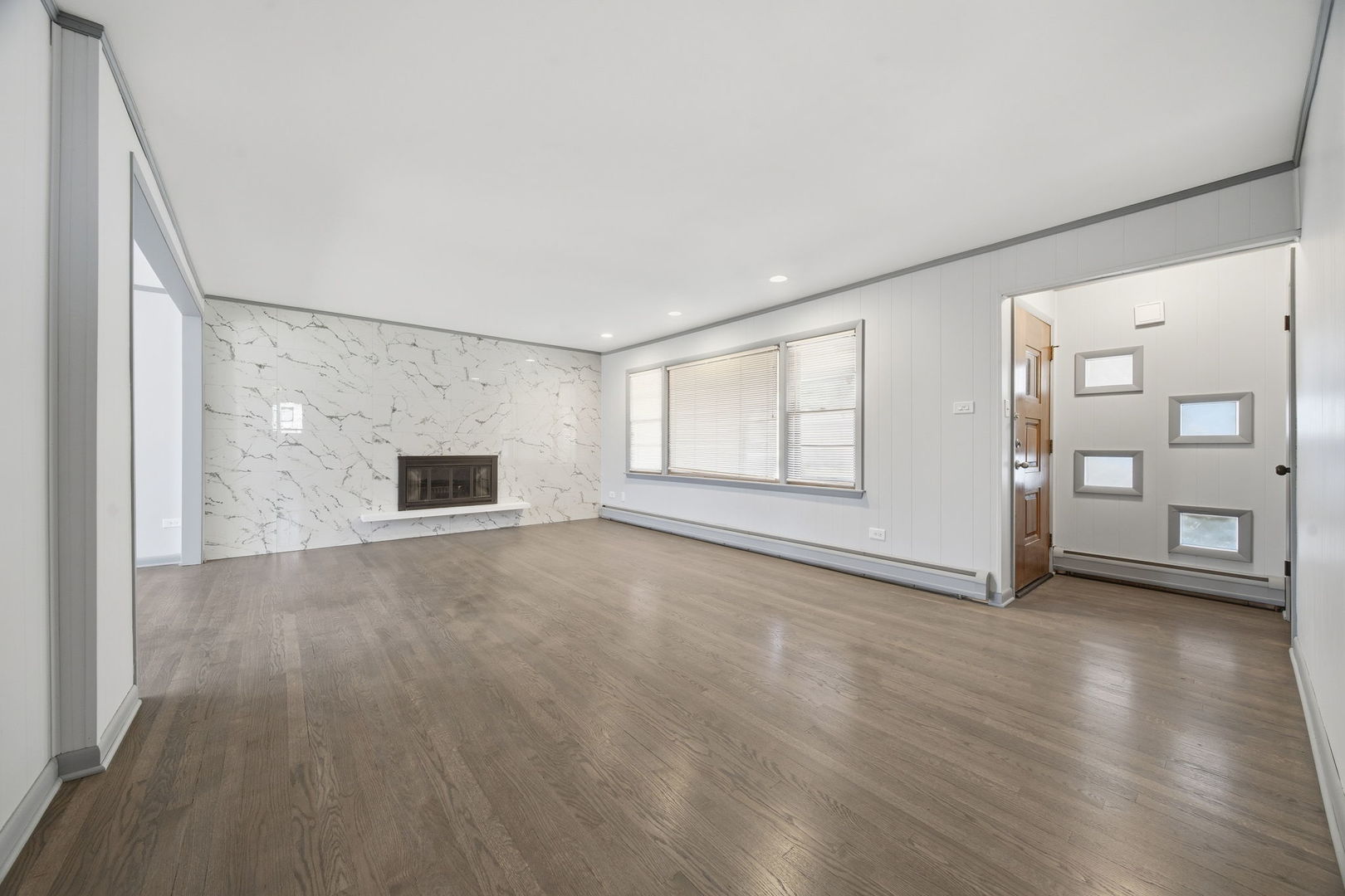 14601 Linder Avenue Midlothian, IL 60445 - Photo 2 of 21 an empty room with windows and cabinet