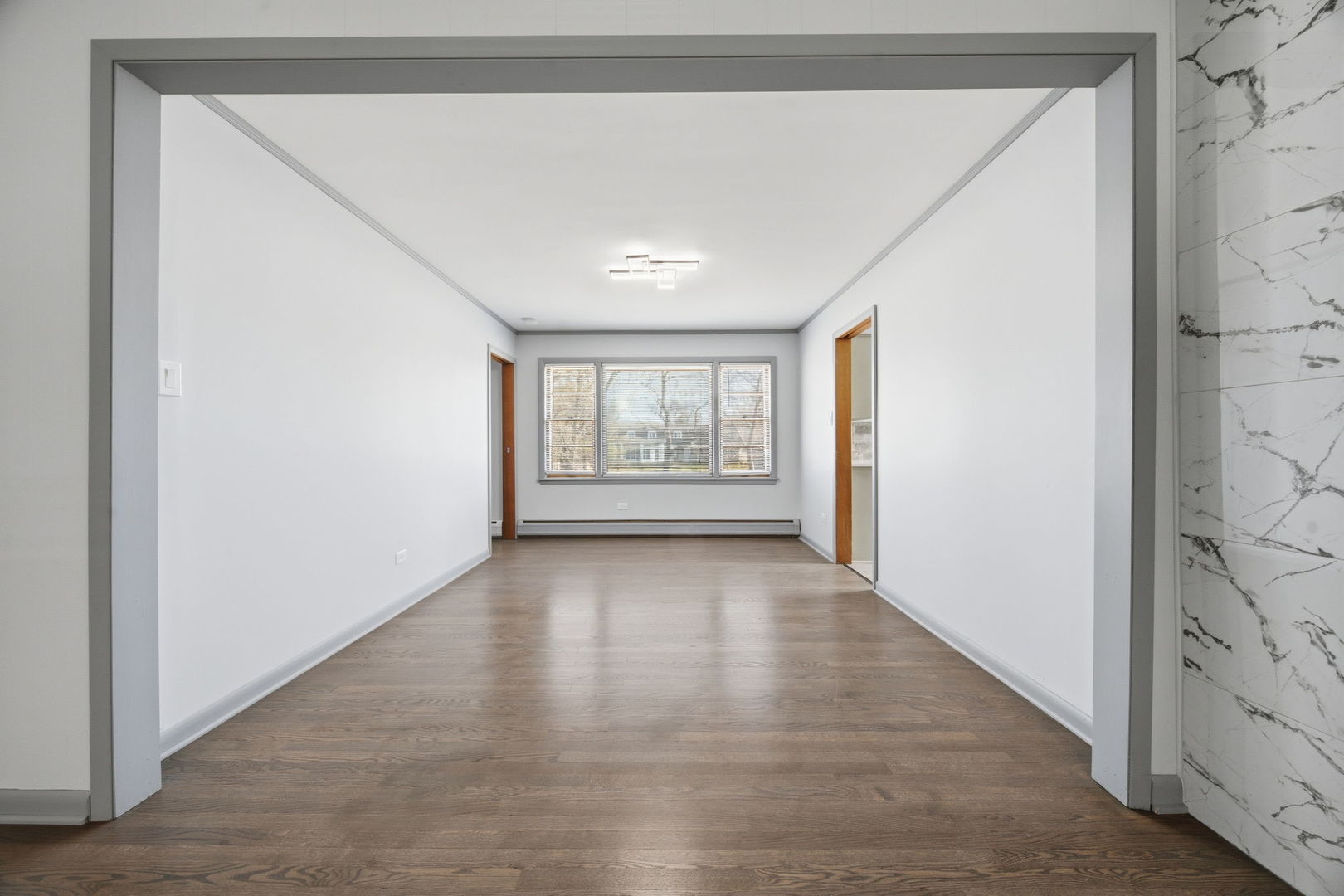14601 Linder Avenue Midlothian, IL 60445 - Photo 5 of 21 a view of an empty room with a window