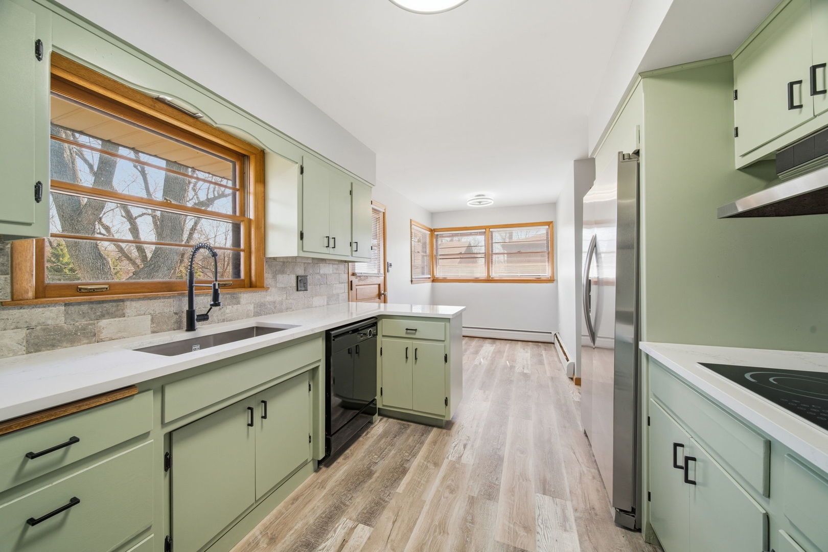 14601 Linder Avenue Midlothian, IL 60445 - Photo 7 of 21 a kitchen with a sink stove and cabinets