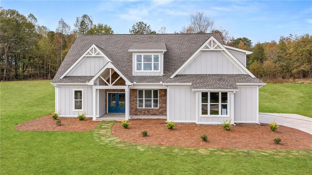a front view of a house with a yard