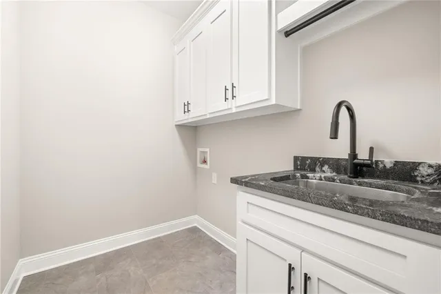 a view of a livingroom with a dishwasher and a window