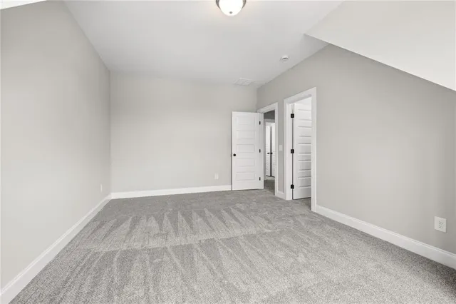 a view of an empty room with windows