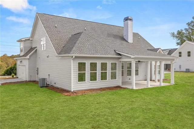 an aerial view of residential houses with outdoor space