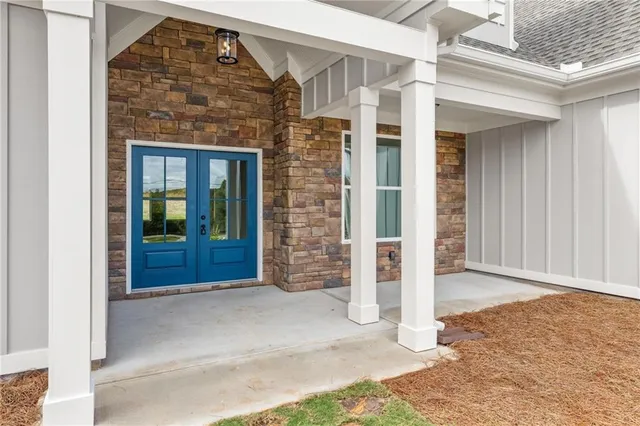 a view of a brick house with large windows