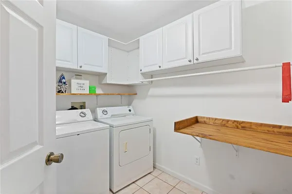 a bathroom with a sink a toilet and shower curtain
