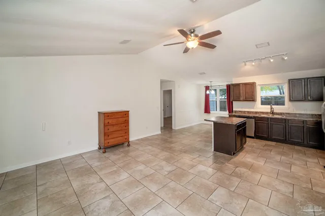 a view of a kitchen with a sink cabinets and window