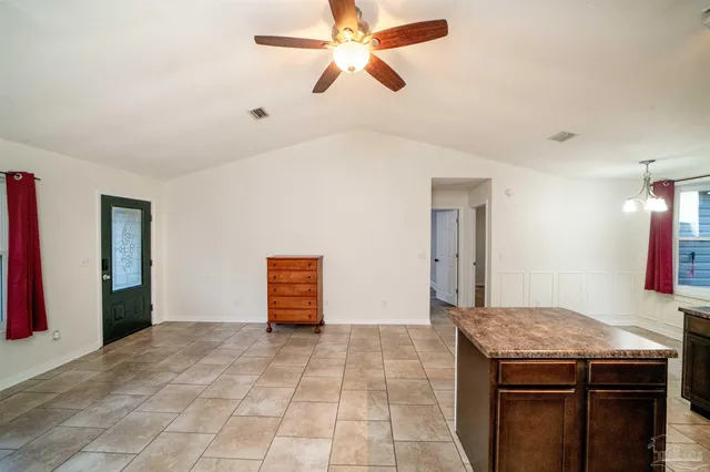 a view of kitchen with a sink and a refrigerator