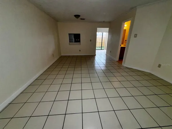 a view of an empty room and window