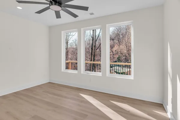 a living room with fireplace furniture and a wooden floor
