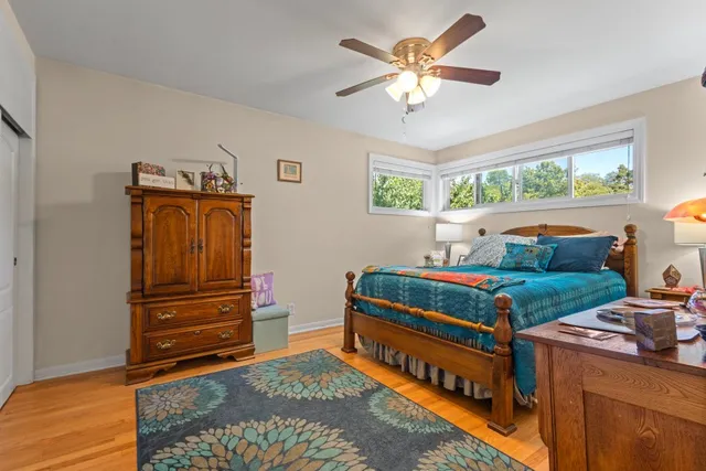 a bedroom with furniture and a window