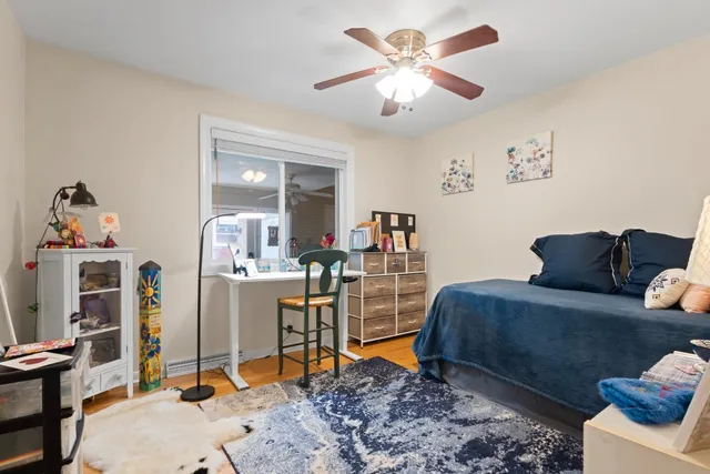 a bedroom with furniture and a chandelier