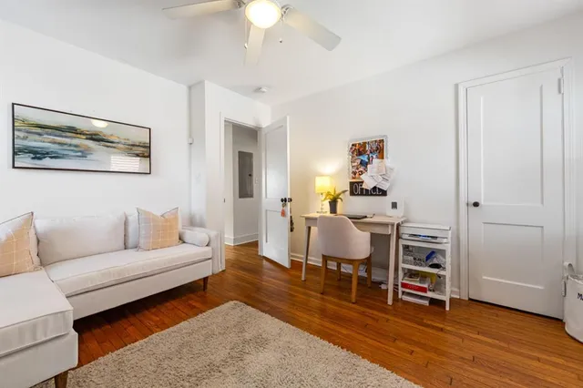 a living room with furniture and a rug