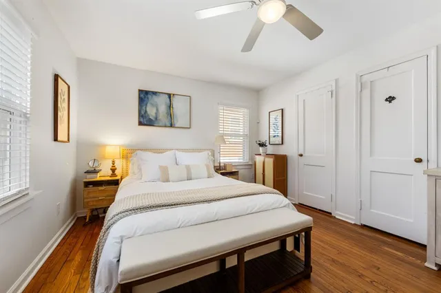 a bedroom with a bed and flat screen tv