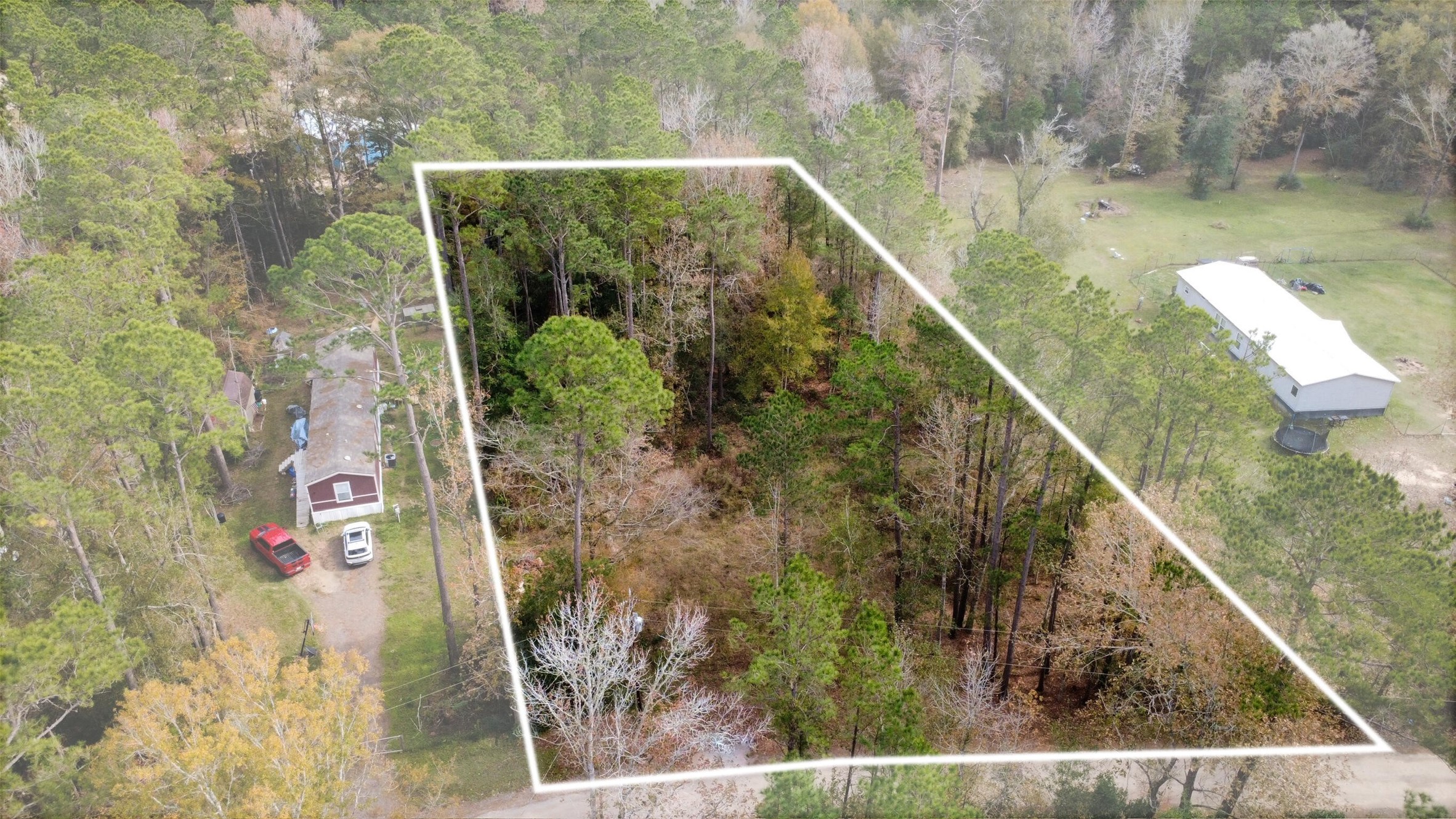 0 L L Denson Road Coldspring, TX 77331 - Photo 2 of 12 a view of a small yard from a balcony