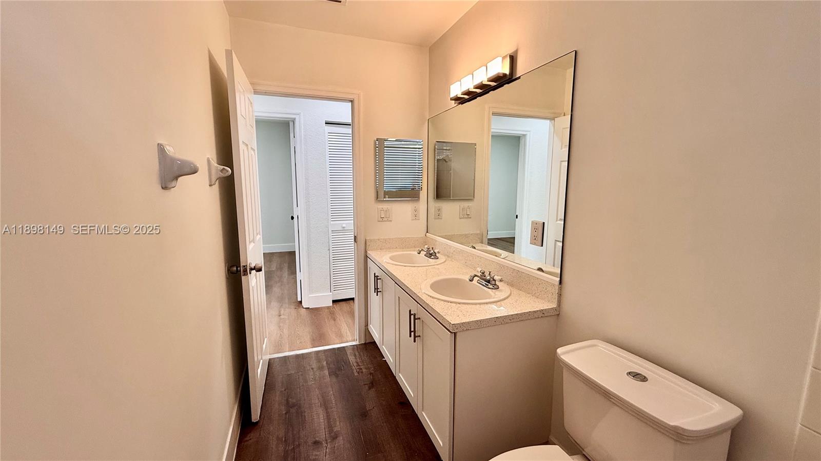 13843 Southwest 31st Street Miramar, FL 33027 - Photo 38 of 58 a bathroom with a sink a toilet and shower