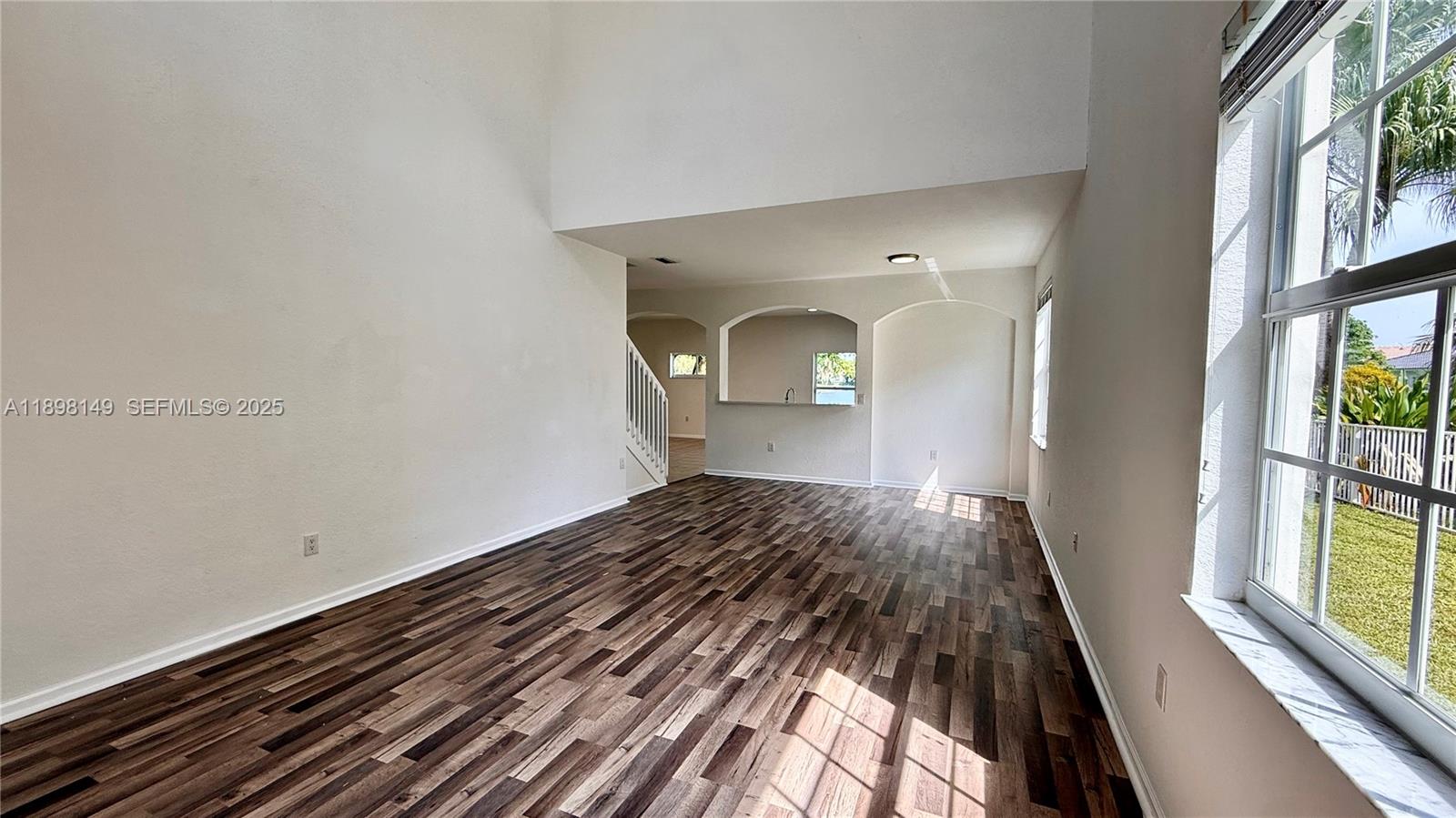 13843 Southwest 31st Street Miramar, FL 33027 - Photo 5 of 58 a view of a room with wooden floor