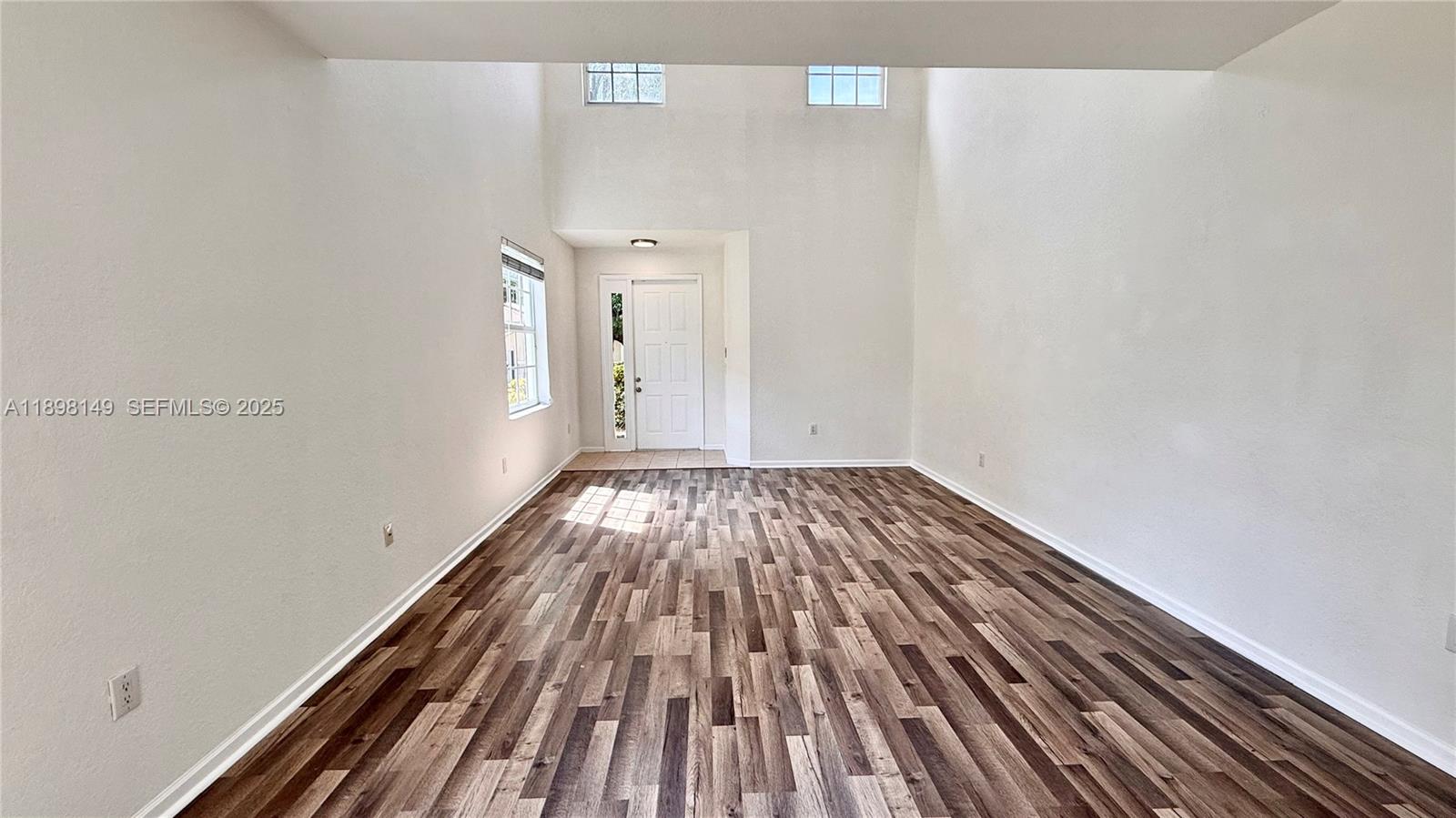 13843 Southwest 31st Street Miramar, FL 33027 - Photo 10 of 58 a view of a room with wooden floor