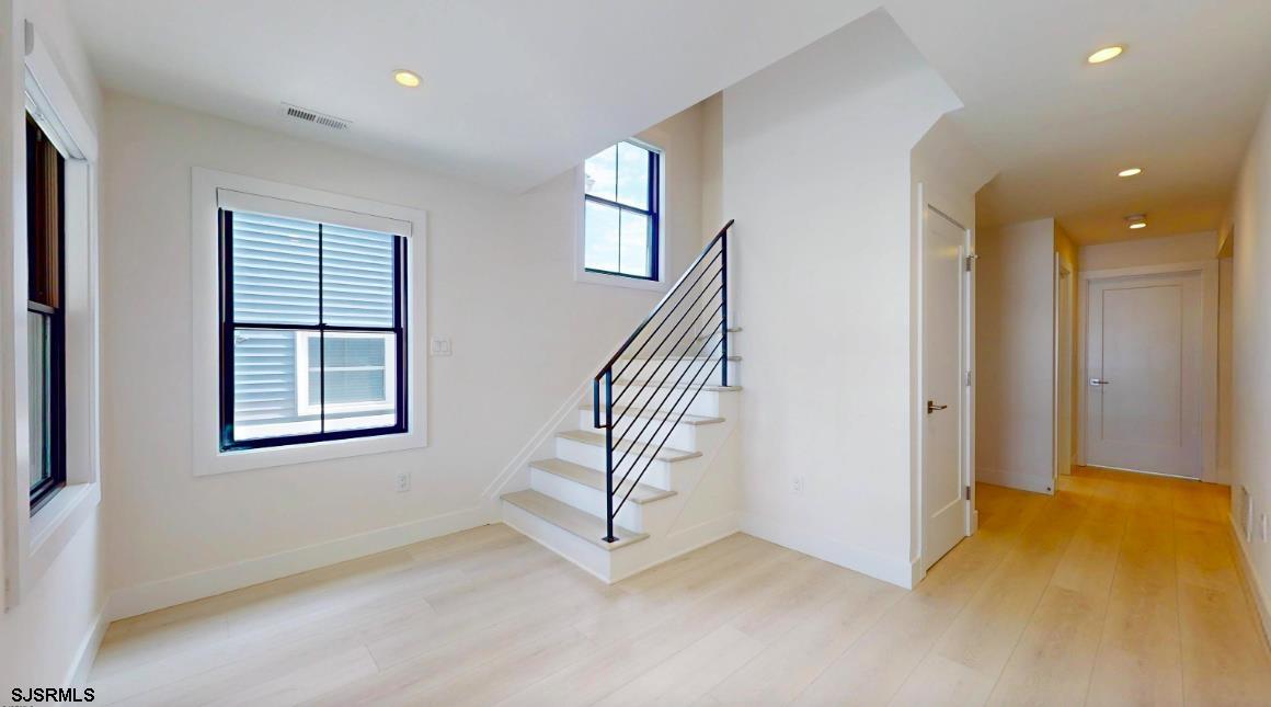 250 8th Street South Brigantine, NJ 08203 - Photo 14 of 33 wooden floor in an empty room with a window