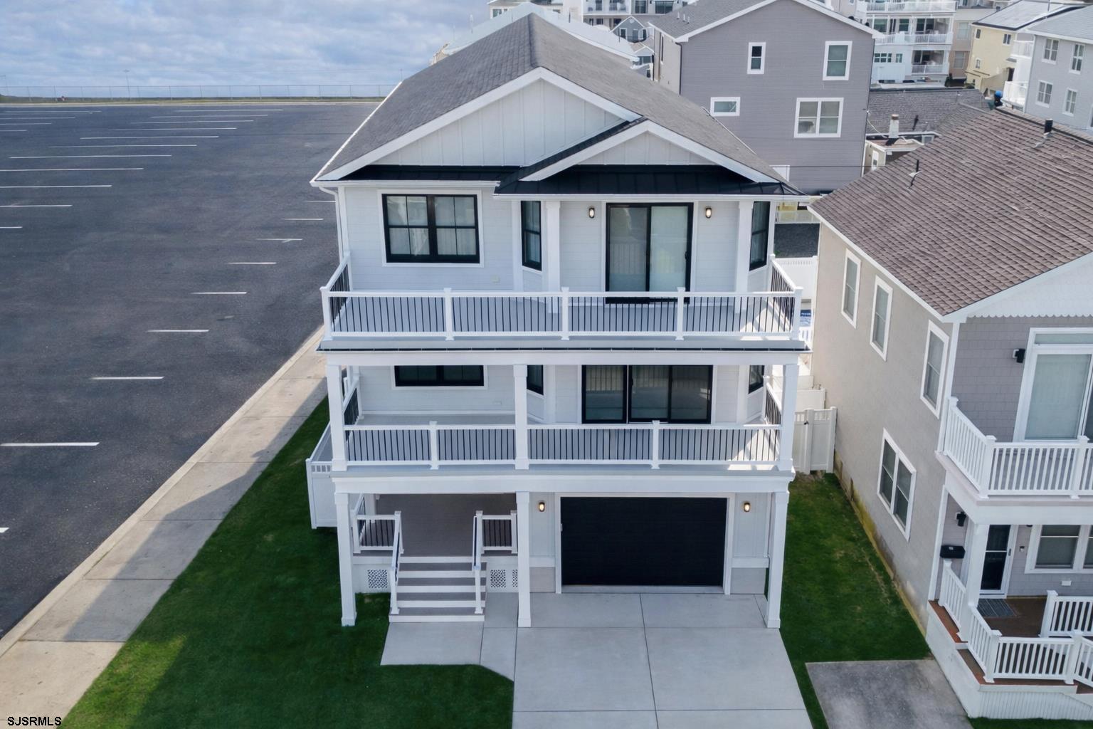 250 8th Street South Brigantine, NJ 08203 - Photo 2 of 34 a front view of a house with a yard