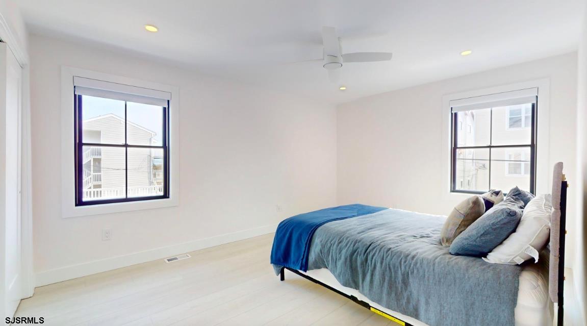 250 8th Street South Brigantine, NJ 08203 - Photo 22 of 33 a bedroom with a bed and a window
