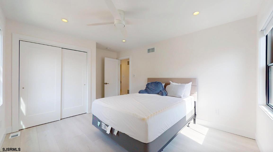 250 8th Street South Brigantine, NJ 08203 - Photo 24 of 33 a large bedroom with a bed and a closet