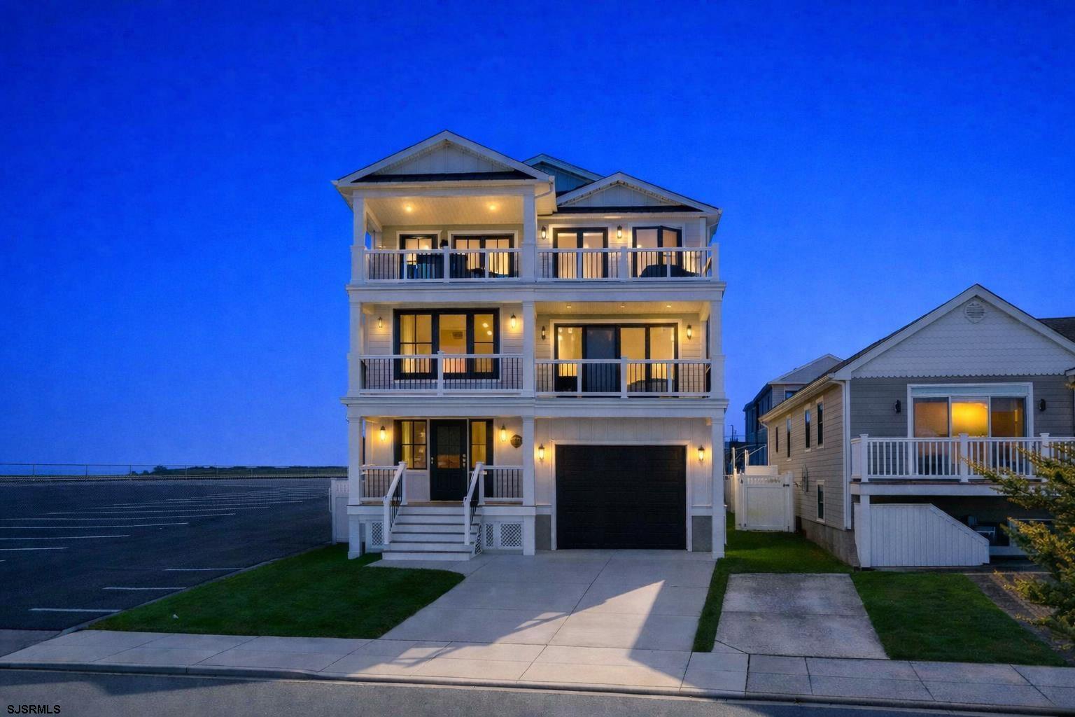250 8th Street South Brigantine, NJ 08203 - Photo 5 of 34 a front view of a house with yard