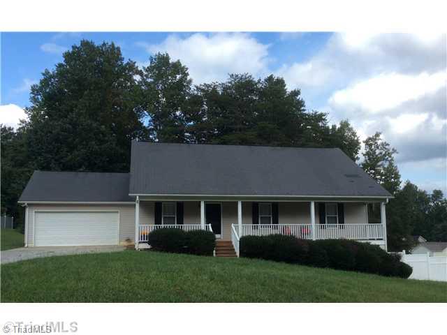 7502 Keating Drive Oak Ridge, NC 27310 - Photo 1 of 16 Exterior Front.