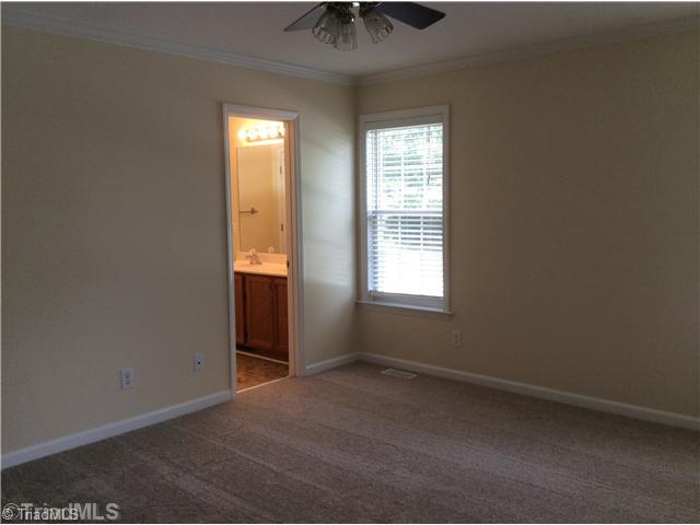 7502 Keating Drive Oak Ridge, NC 27310 - Photo 12 of 16 Master Bedroom. Master bedroom has a nice walk in closet with built in shelving.