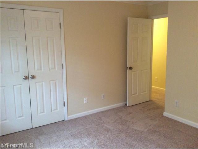 7502 Keating Drive Oak Ridge, NC 27310 - Photo 13 of 16 1st Bedroom. Both bedrooms have double door closets.