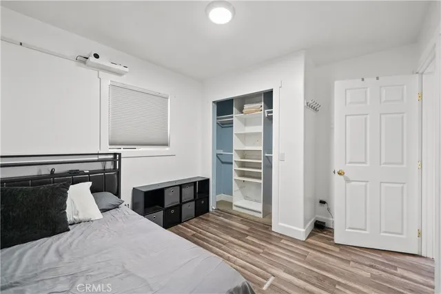 a bedroom with a bed and a cabinets