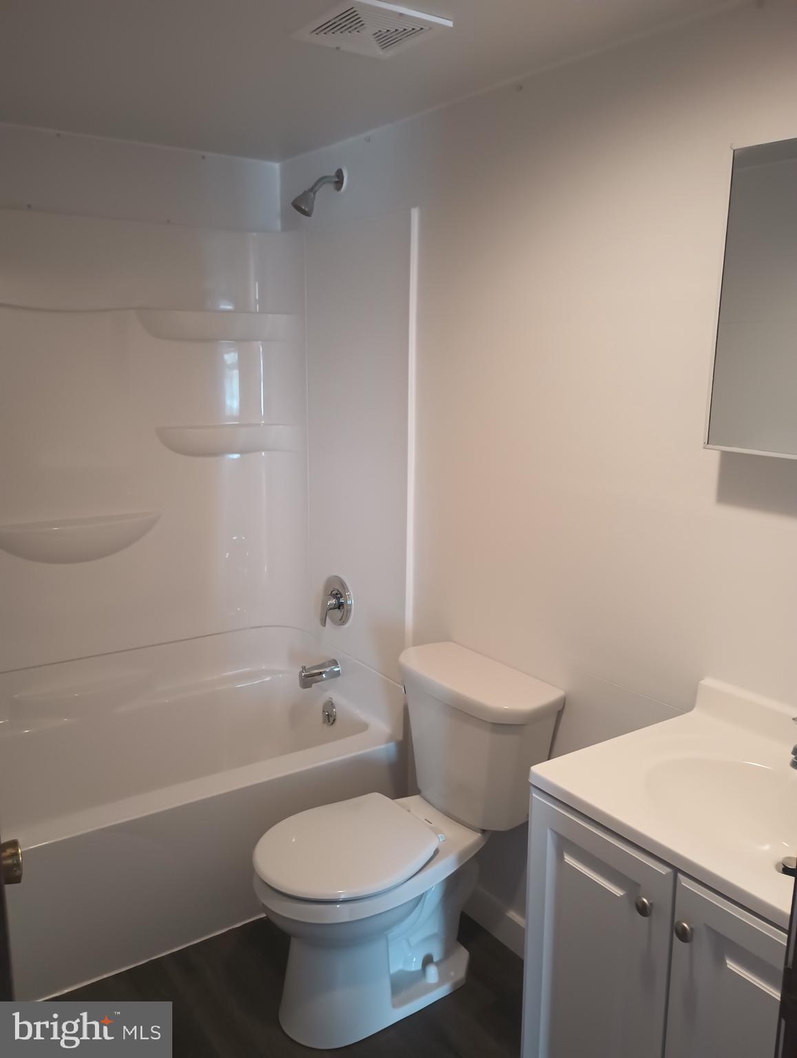 356 Keneagy Hill Road, Unit 27 Ronks, PA 17572 - Photo 9 of 10 a white toilet sitting next to a bath tub