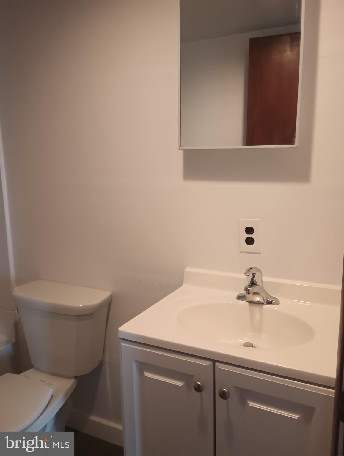 356 Keneagy Hill Road, Unit 27 Ronks, PA 17572 - Photo 10 of 10 a bathroom with a toilet sink and mirror