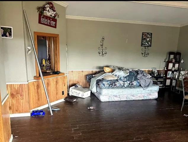 a view of living room with furniture and a wooden floor
