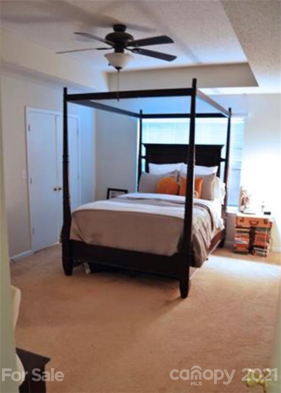 8311 Springhead Lane Charlotte, NC 28215 - Photo 7 of 11 a bed room with a bed and a window