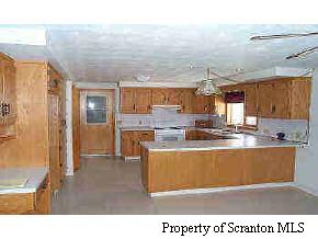 Tinker Creek Road Forest City, PA 18421 - Photo 6 of 9 a view of a living room and kitchen