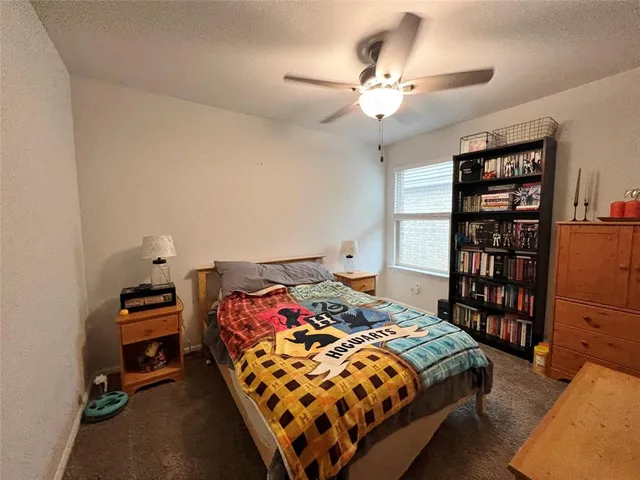a bedroom with a bed and closet