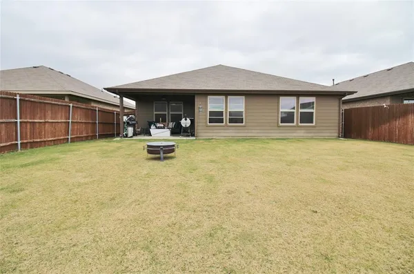 a view of a house with swimming pool and sitting area