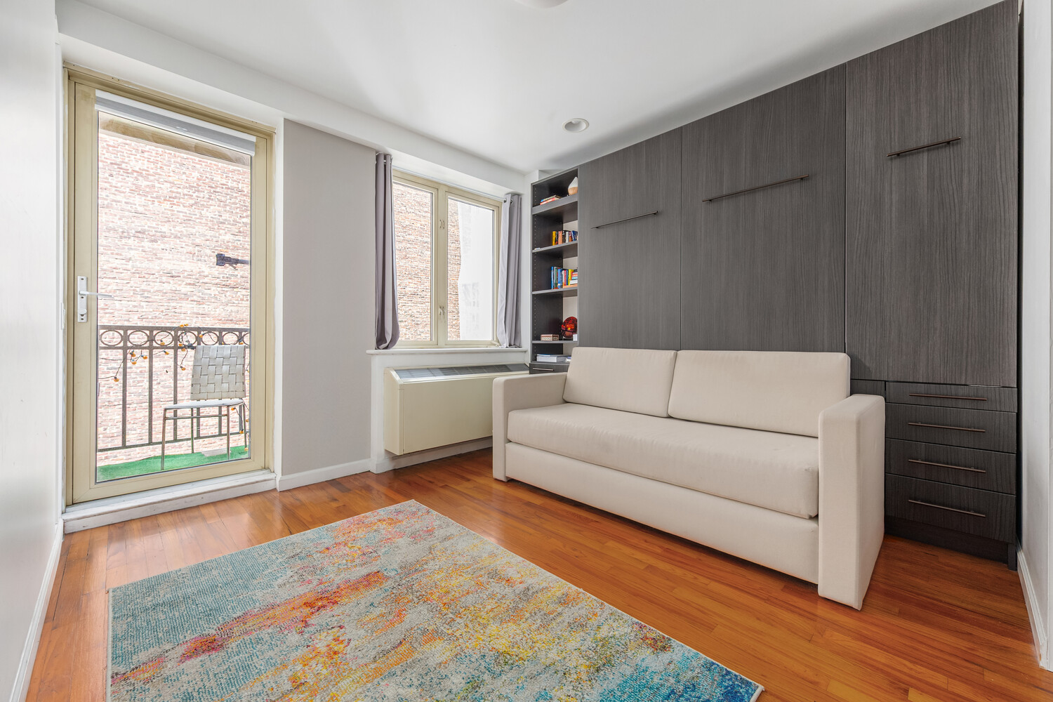 845 2nd Avenue, Unit 6B Manhattan, NY 10017 - Photo 2 of 7 a living room with furniture and a window