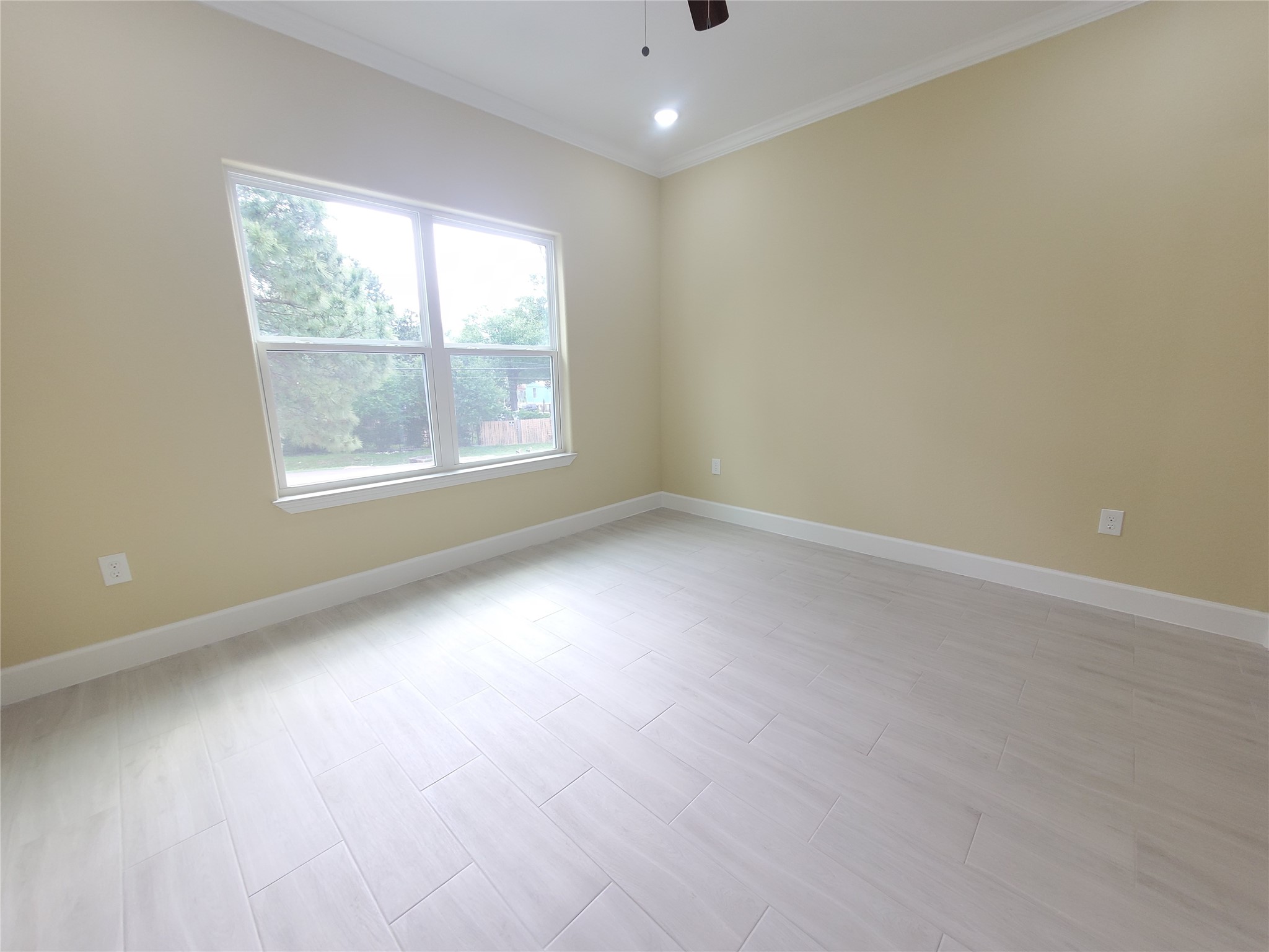 1306 North 9th Street Conroe, TX 77301 - Photo 40 of 47 an empty room with a window