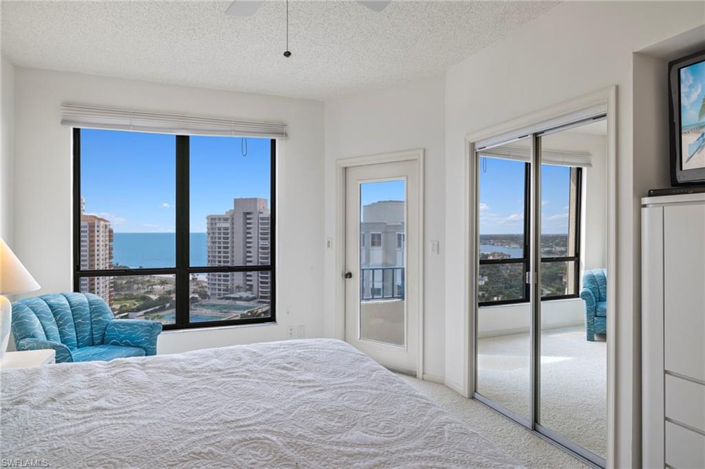 4451 Gulf Shore Boulevard North, Unit 2002 Naples, FL 34103 - Photo 13 of 42 a view of a bedroom with closet