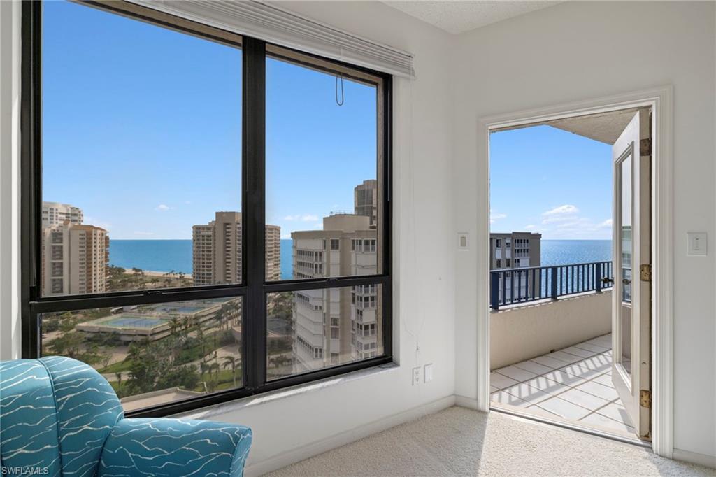 4451 Gulf Shore Boulevard North, Unit 2002 Naples, FL 34103 - Photo 14 of 42 a view of a balcony from a living room