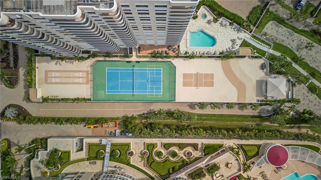 4451 Gulf Shore Boulevard North, Unit 2002 Naples, FL 34103 - Photo 27 of 42 a front view of a house with garden