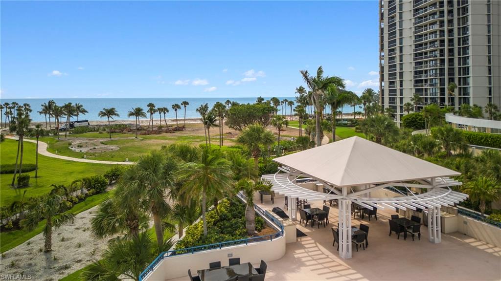 4451 Gulf Shore Boulevard North, Unit 2002 Naples, FL 34103 - Photo 34 of 42 a view of a terrace with sitting area
