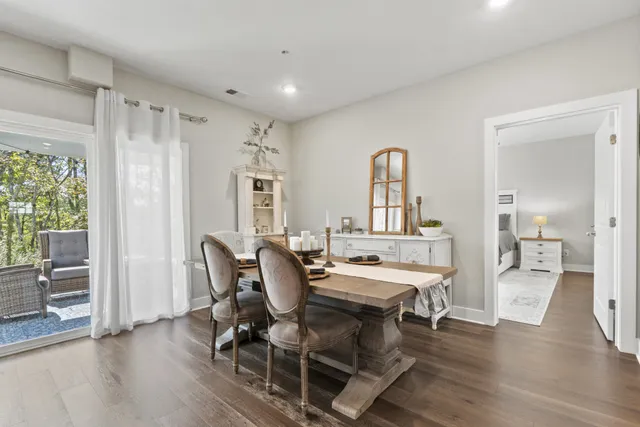 a view of a dining room with furniture and a window