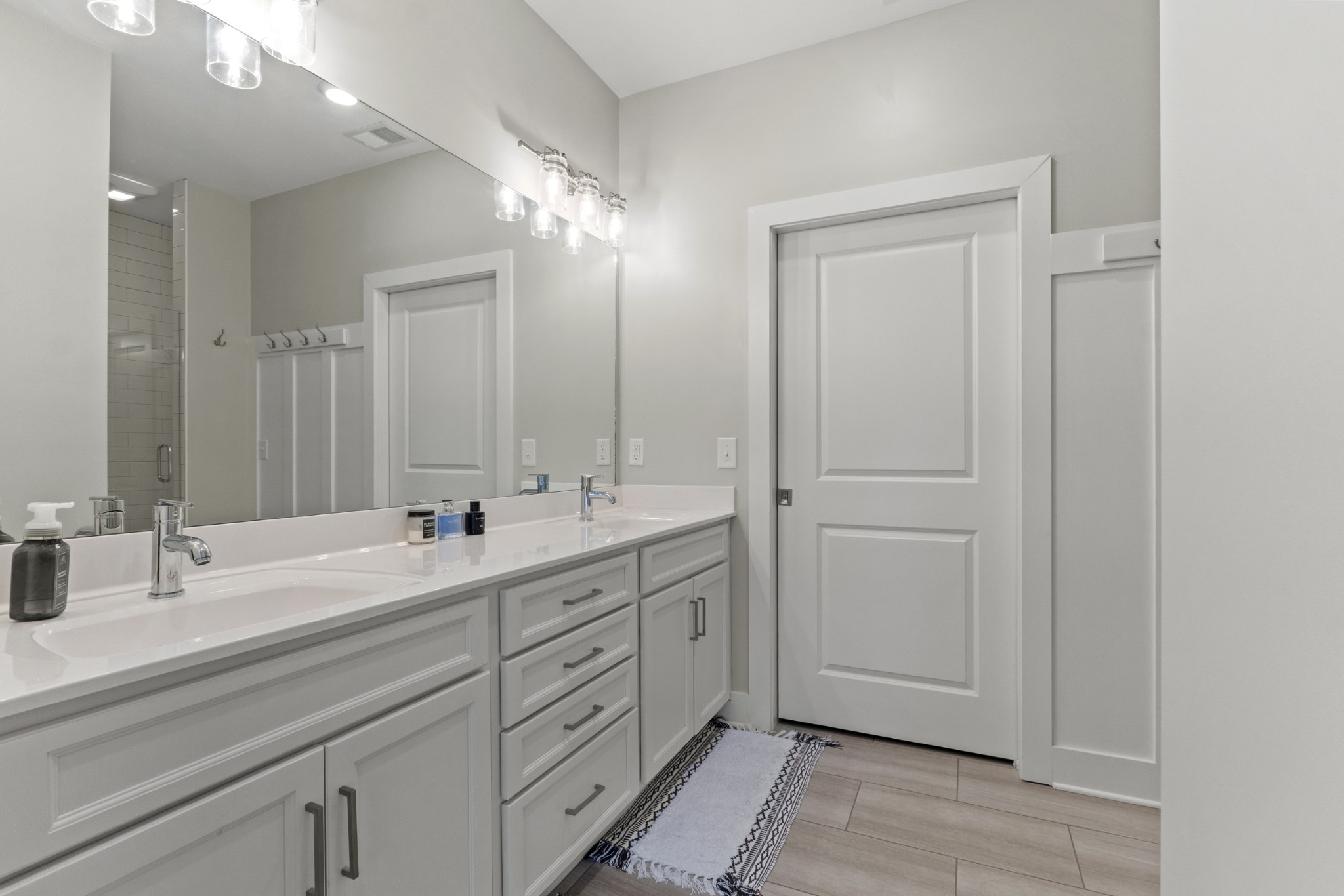 1144 Lock 4 Road, Unit J4 Gallatin, TN 37066 - Photo 22 of 50 a bathroom with double vanity sink and a mirror