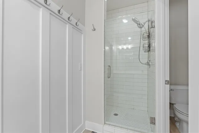 a bathroom with a glass shower door