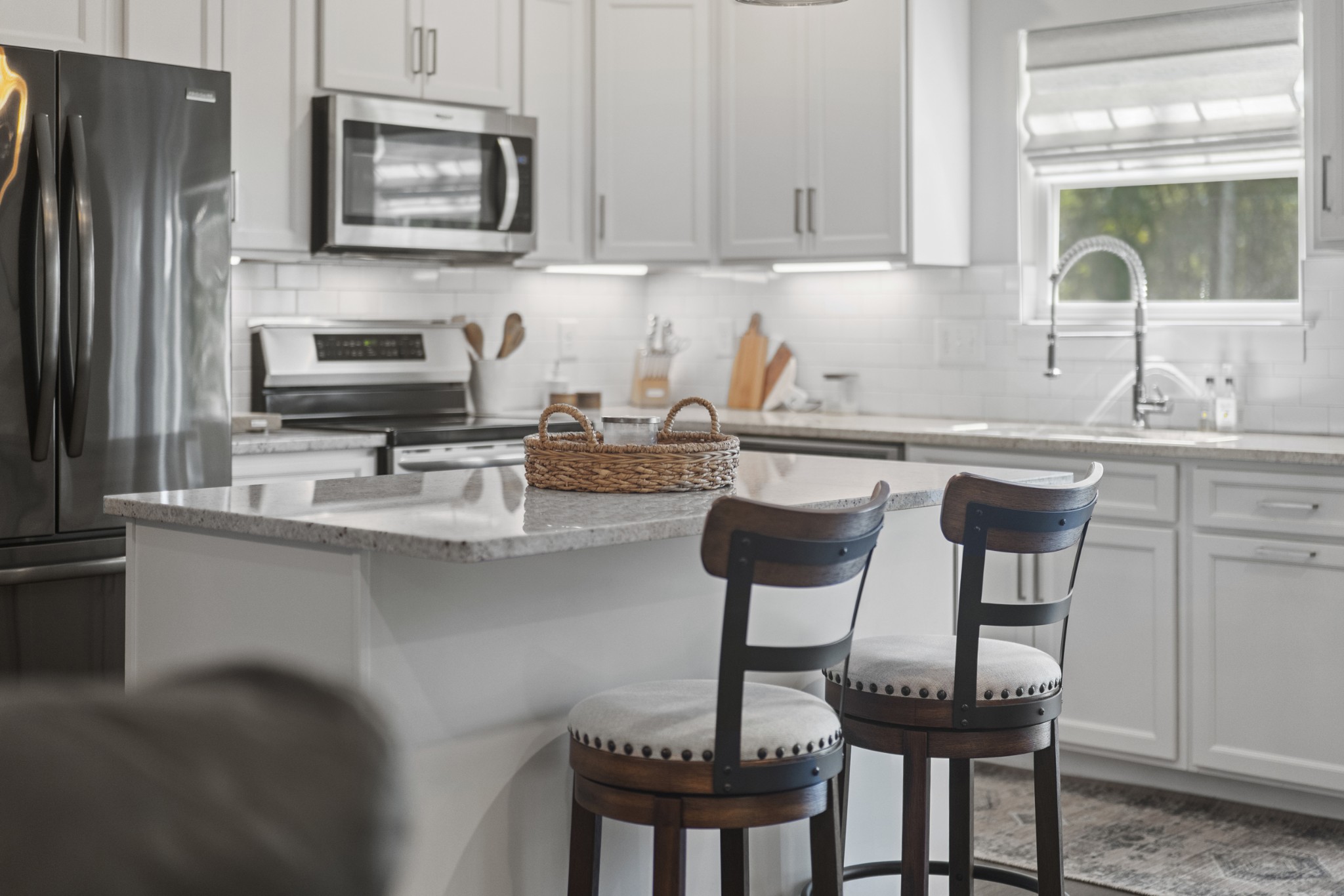 1144 Lock 4 Road, Unit J4 Gallatin, TN 37066 - Photo 36 of 50 a kitchen with stainless steel appliances a sink a stove a table and chairs