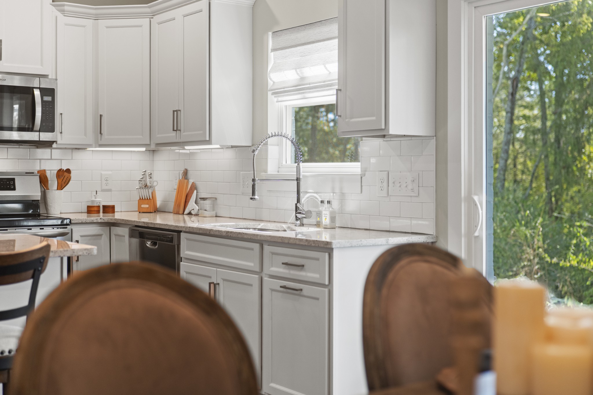 1144 Lock 4 Road, Unit J4 Gallatin, TN 37066 - Photo 38 of 50 a kitchen with stainless steel appliances granite countertop a sink a stove and cabinets