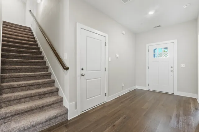 a view of entryway with wooden floor