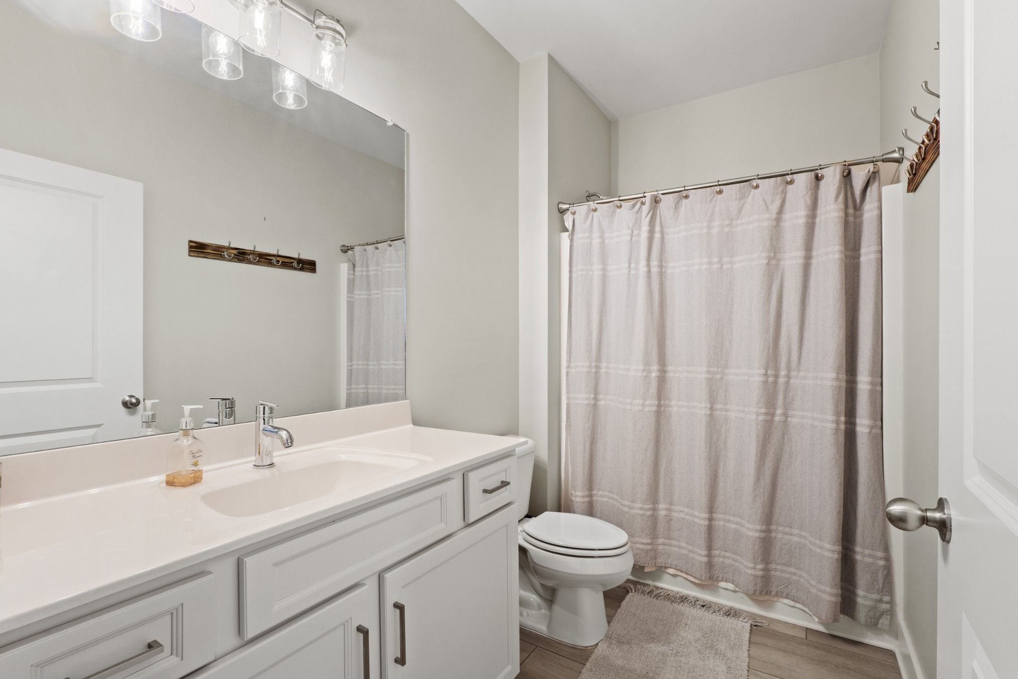 1144 Lock 4 Road, Unit J4 Gallatin, TN 37066 - Photo 6 of 50 a bathroom with a sink a toilet and shower